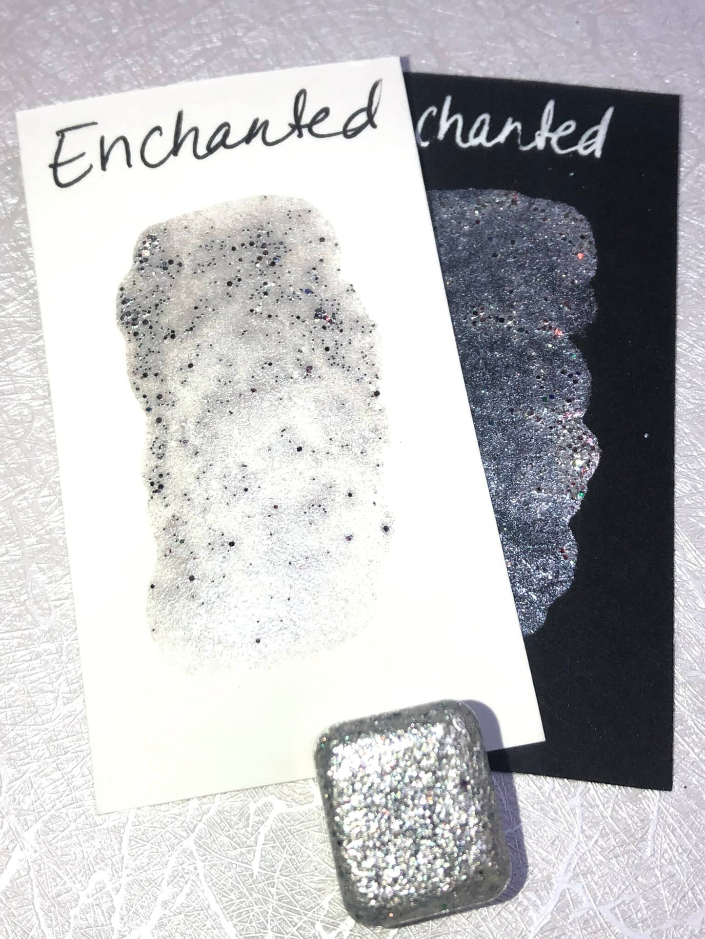 Enchanted shimmer watercolor paint half pan with swatch photo